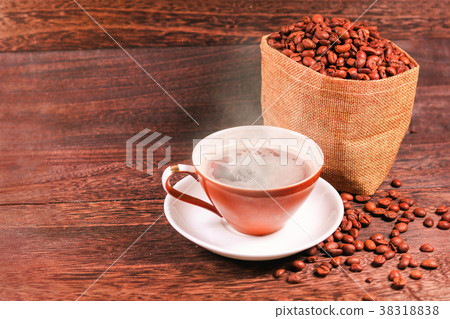 Cup of black coffee and coffee beans  38318838