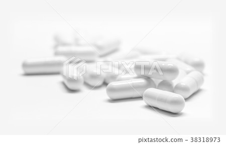 White medicine capsules on white background White medicine capsules on white background 38318973
