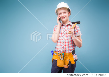 portrait of a young builder in a helmet and a tape portrait of a young builder in a helmet and a tape 38319083