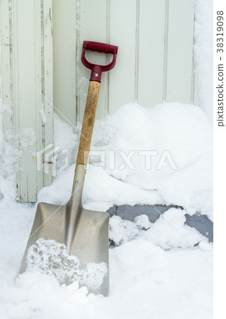 Shovel outside in the snow 38319098