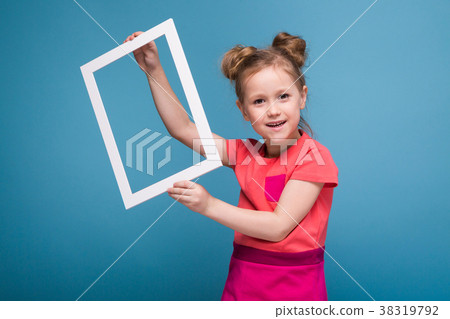 Beautiful cute little girl in pink dress holds Beautiful cute little girl in pink dress holds 38319792