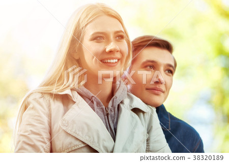 Spring couple walking park . Summer friends walk Spring couple walking park . Summer friends walk 38320189