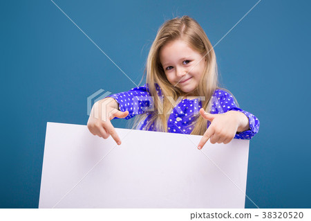 Cute little girl in purple dress holds empty Cute little girl in purple dress holds empty 38320520