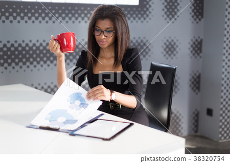 Beautiful young business lady in black strong 38320754