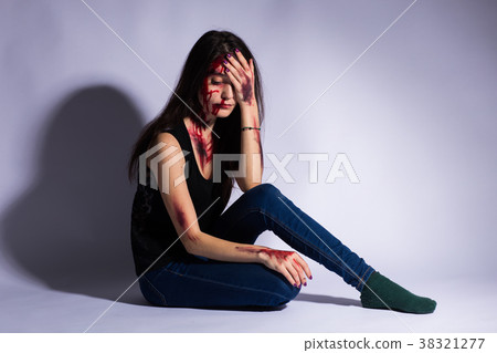 Rape battered bloody victim sad woman sits on the 38321277