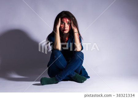 Rape battered bloody victim sad woman sits on the 38321334
