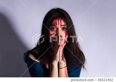 Rape battered bloody victim sad woman sits on the 38321402