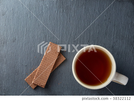 Top view on a cup of tea and cookies isolated on a 38322112