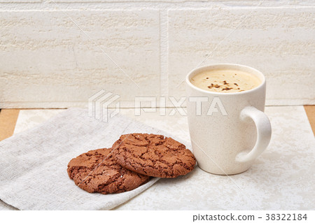 Cup of coffee and biscuit isolated on the white 38322184