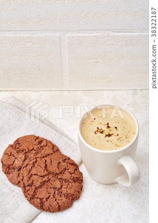 Cup of coffee and biscuit isolated on the white 38322187
