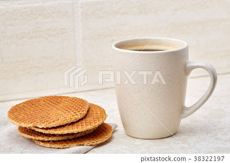 Cup of coffee and biscuit isolated on the white 38322197
