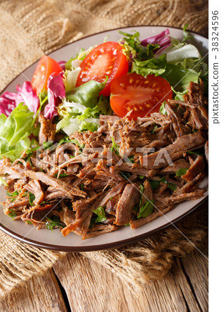 Slowly cooked beef with fresh vegetable salad Slowly cooked beef with fresh vegetable salad 38324596