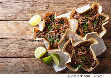 Pulled beef with lime and greens in a tortillas 38324599