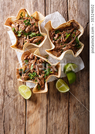 Pulled beef with lime and greens in a tortillas Pulled beef with lime and greens in a tortillas 38324602