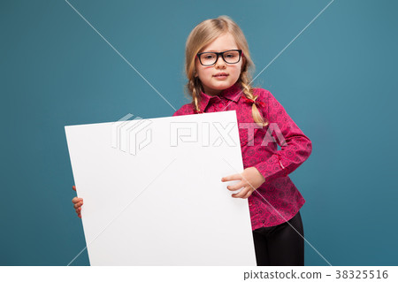 Adorable little girl in pink shirt, black trousers 38325516