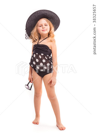 Attractive cute little girl in in black swimwear Attractive cute little girl in in black swimwear 38325657