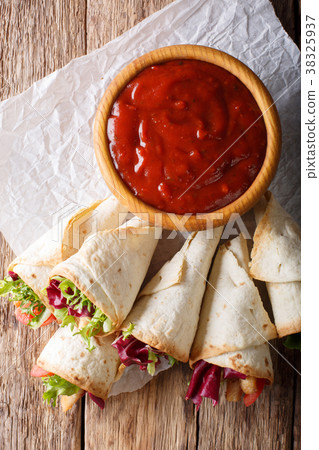 Freshly cooked burritos with turkey, lettuce 38325937