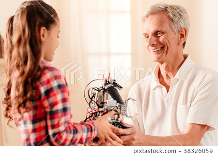 Extremely happy family members talking over new Extremely happy family members talking over new 38326059