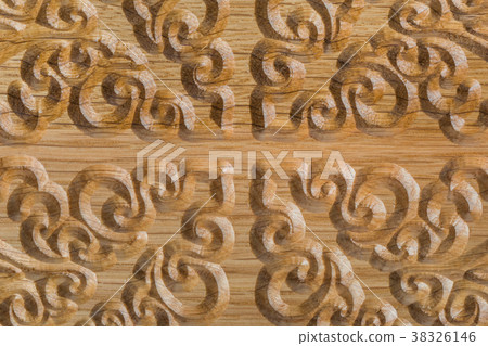 Carved pattern on wood background 38326146
