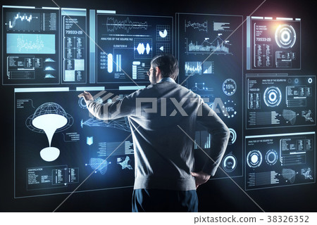 Professional programmer standing alone and looking Professional programmer standing alone and looking 38326352