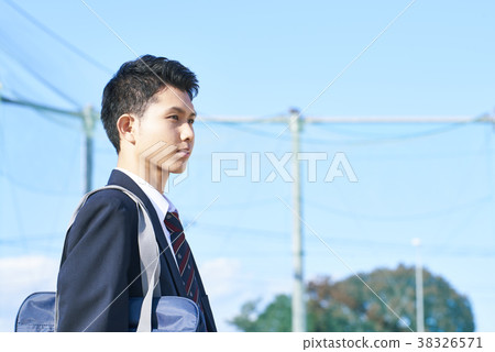 Male school students standing in schoolyard 38326571
