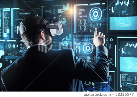 Bearded programmer wearing special glasses while Bearded programmer wearing special glasses while 38326577