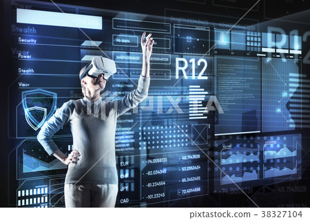 Positive programmer smiling and putting her hand 38327104