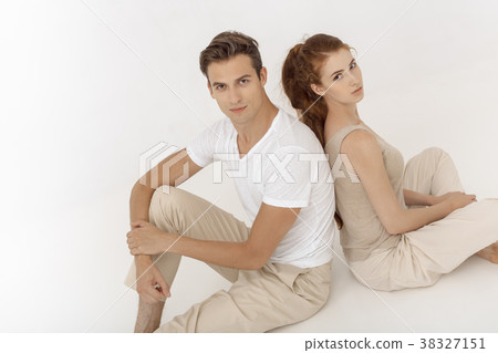 Yound couple indoors in studio. Yound couple indoors in studio. 38327151