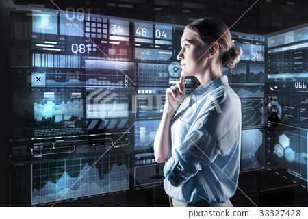 Young woman thoughtfully looking at the screen and Young woman thoughtfully looking at the screen and 38327428