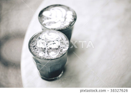 Two activated charcoal lattes Two activated charcoal lattes 38327626