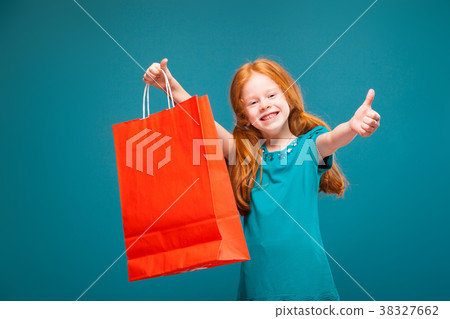Pretty, cute little girl in blue clothes with long Pretty, cute little girl in blue clothes with long 38327662