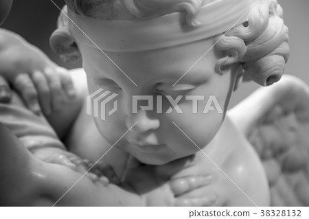 Beautiful marble statue of angel head detail Beautiful marble statue of angel head detail 38328132