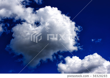 white clouds in the bright blue sky 38328283