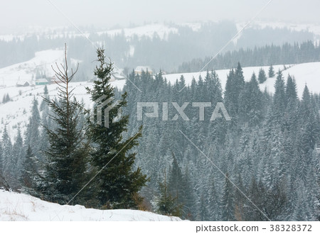 Early morning winter mountain village landscape 38328372