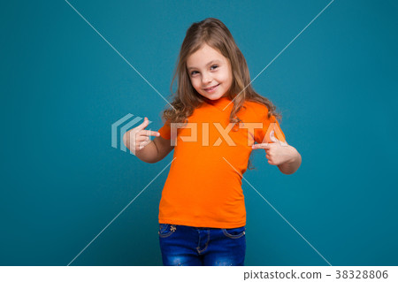 Cute Little Girl In Tee Shirt With Brown Hair Stock Photo