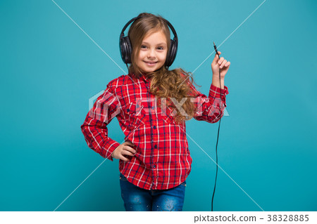 Pretty, little girl in checkered shirt and 38328885