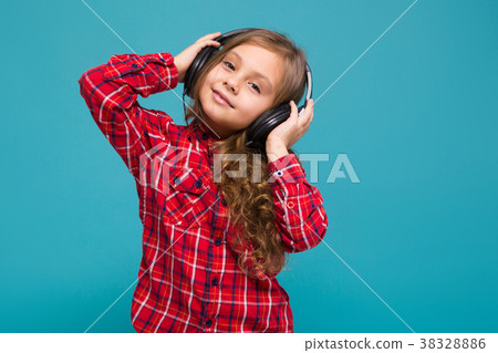Pretty, little girl in checkered shirt and 38328886