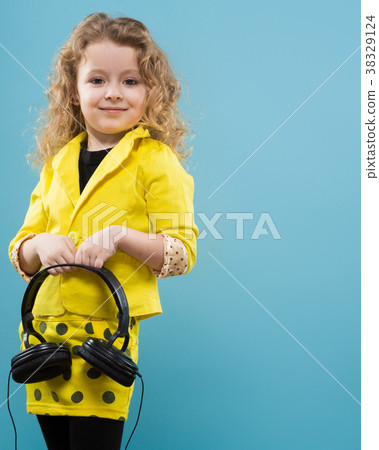Cute young girl in earphones 38329124