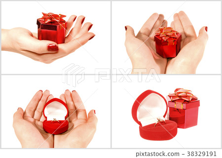 Box with a jewel gift in hands 38329191