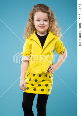 Cute young girl dressed all in yellow Cute young girl dressed all in yellow 38329571