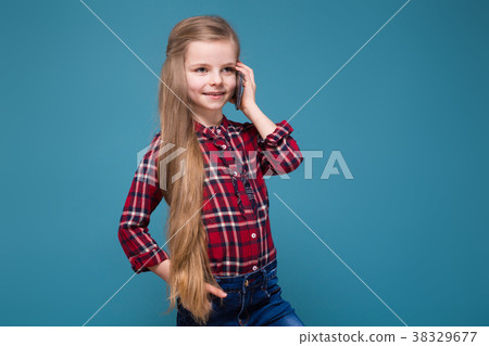 Cute girl in shirt with long hair hold the phone 38329677