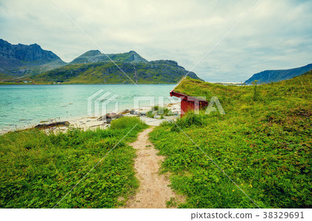Fjord in rainy weather. Fishing house on the beach Fjord in rainy weather. Fishing house on the beach 38329691