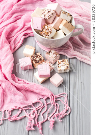 Assorted marshmallow on a gray table Assorted marshmallow on a gray table 38329726