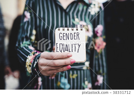 woman shows notepad with the text gender equality woman shows notepad with the text gender equality 38331712