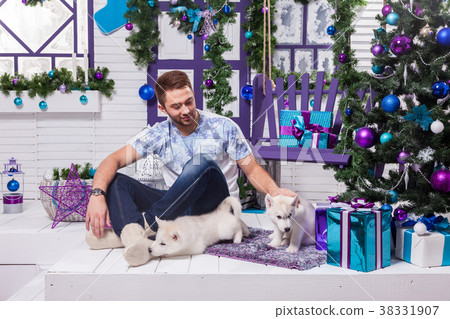 beautiful man sitting on a terrace next to a beautiful man sitting on a terrace next to a 38331907