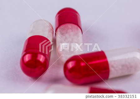 red-white capsules on a white background red-white capsules on a white background 38332151