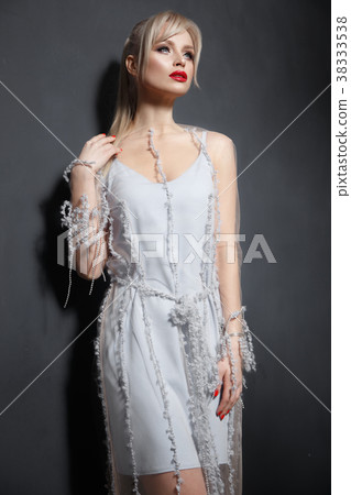 Beautiful girl in designer fashionable transparent Beautiful girl in designer fashionable transparent 38333538