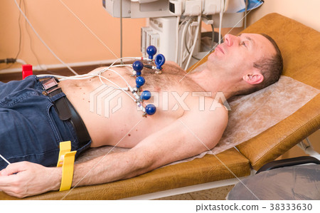 Cardiology. The cardiologist examines the patient 38333630