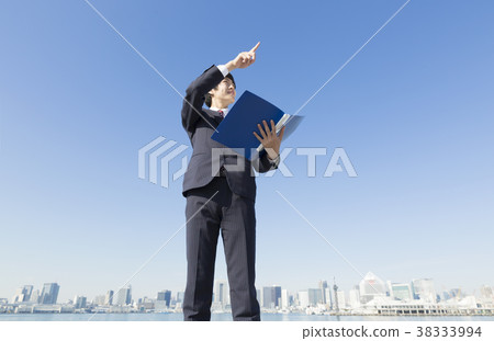 Businessman file and pointing finger Businessman file and pointing finger 38333994