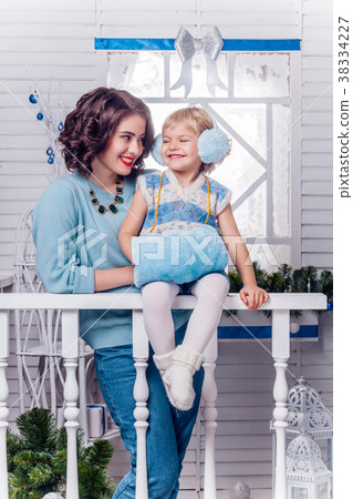 smiling little girl with her older sister standing 38334227